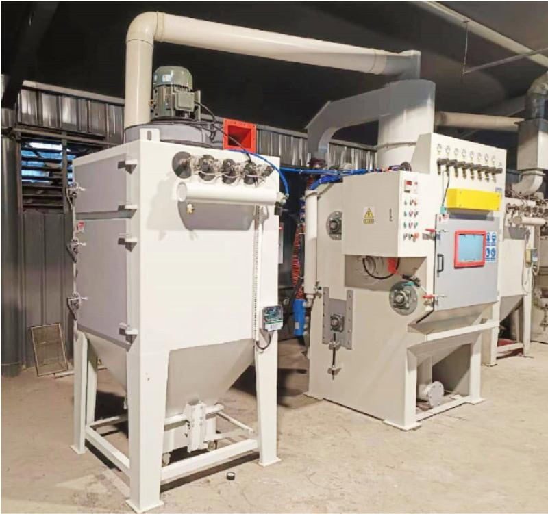 Closed-Loop Rubber Belt Blasting Machine | Low-Waste Surface Preparation System Rubber belt tumble blasting system with conical debris hopper and airless technology - eco-friendly abrasive recycling for automotive parts.
