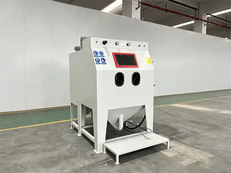TS1212 suction blasting cabinet for industrial abrasive blasting, cleaning, and surface finishing of medium-sized metal parts.