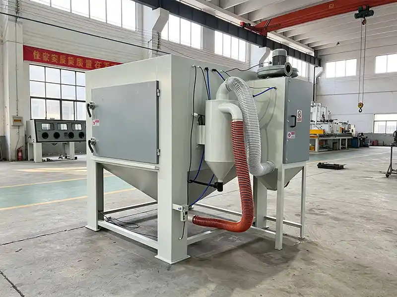 Side view of TS1515 suction blasting cabinet featuring large working chamber and industrial blasting system.