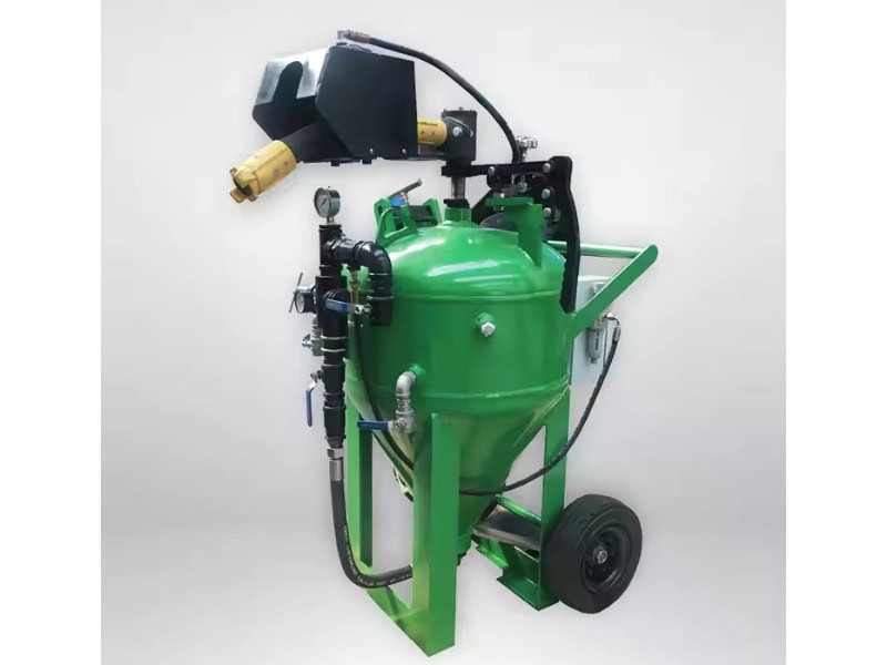 Green portable water sandblasting machine with black control panel, wheels, and side hoses.
