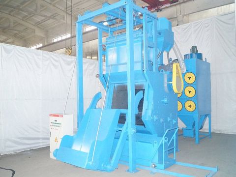Blue industrial auto-loading tumblast shot blasting machine with roller conveyor for automated processing