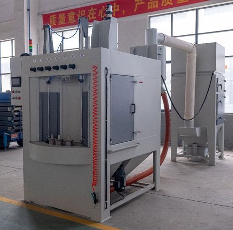 Rotary turntable sandblast equipment with quality control banner and pneumatic controls - batch processing solution for uniform surface finishing.