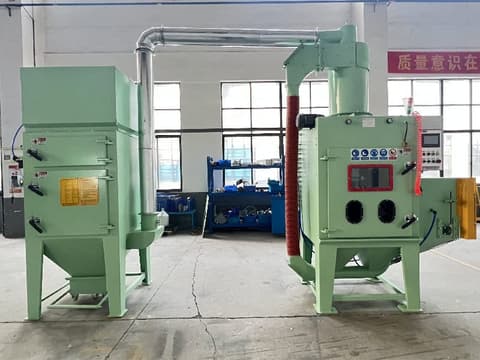 Light green Pin Thread Blasting Machine with dust collector (left) and main blasting unit (right) featuring control panel and metal pipes in factory setting.