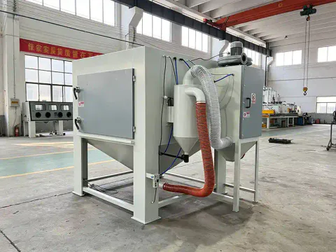Side view of TS1515 suction blasting cabinet featuring large working chamber and industrial blasting system.